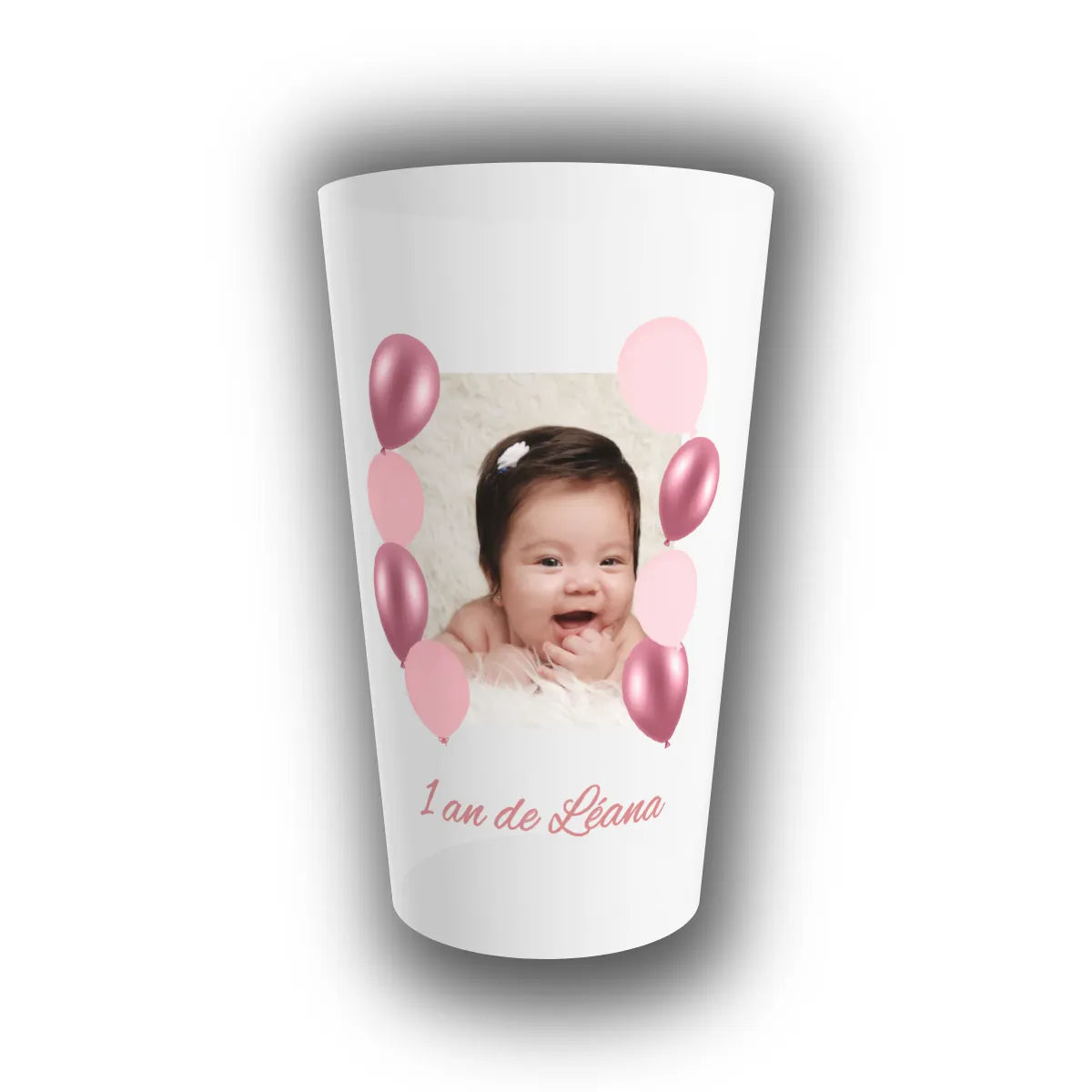 Gobelet translucide personnalisé avec la photo de l'enfant encadrée de ballons roses et son âge inscrit, pour un anniversaire tout en douceur